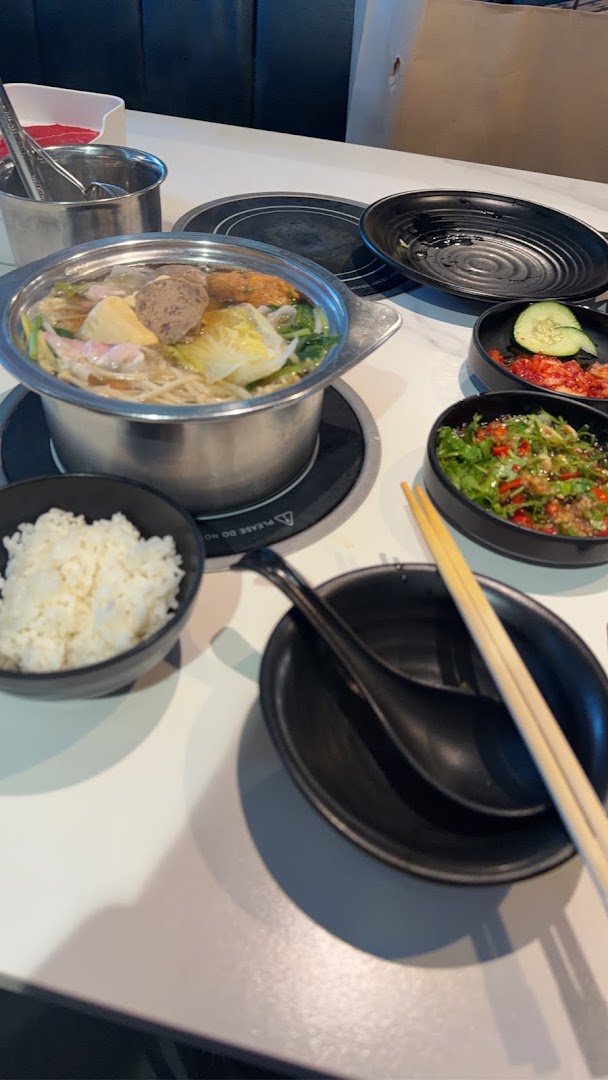 Individual pots set on a table, ready for dinner.