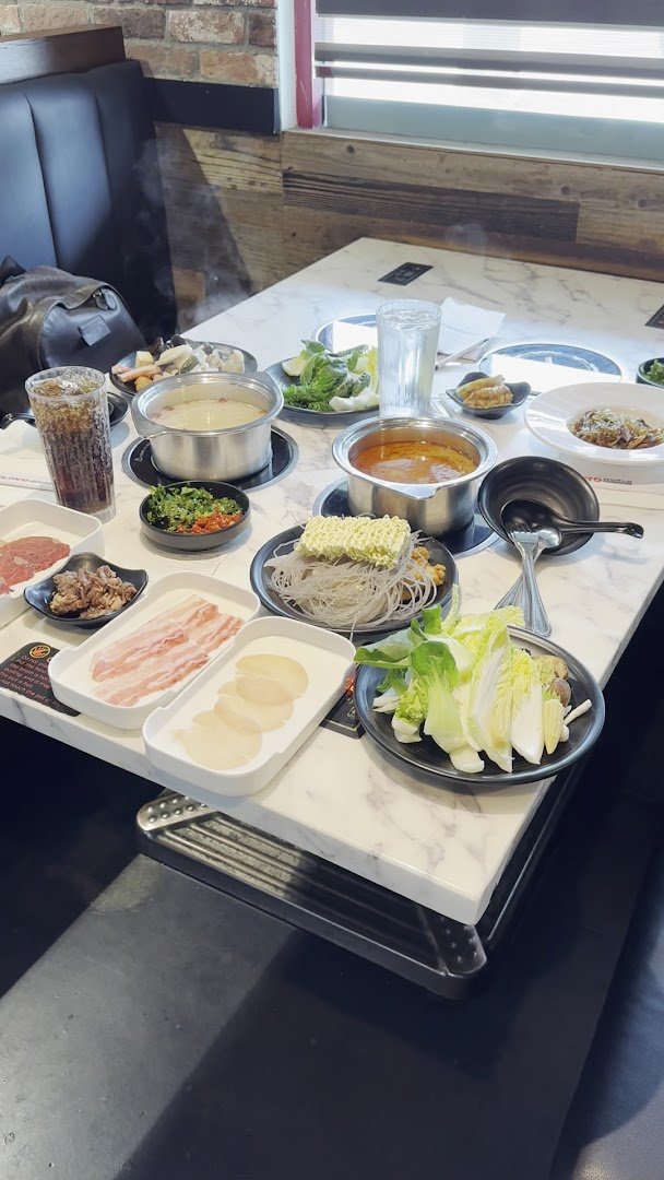 Bright dining room with tables for hot pot meals.